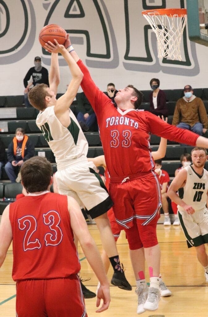 Shane Keenan gets a block on Shenandoah's MAx McVicker