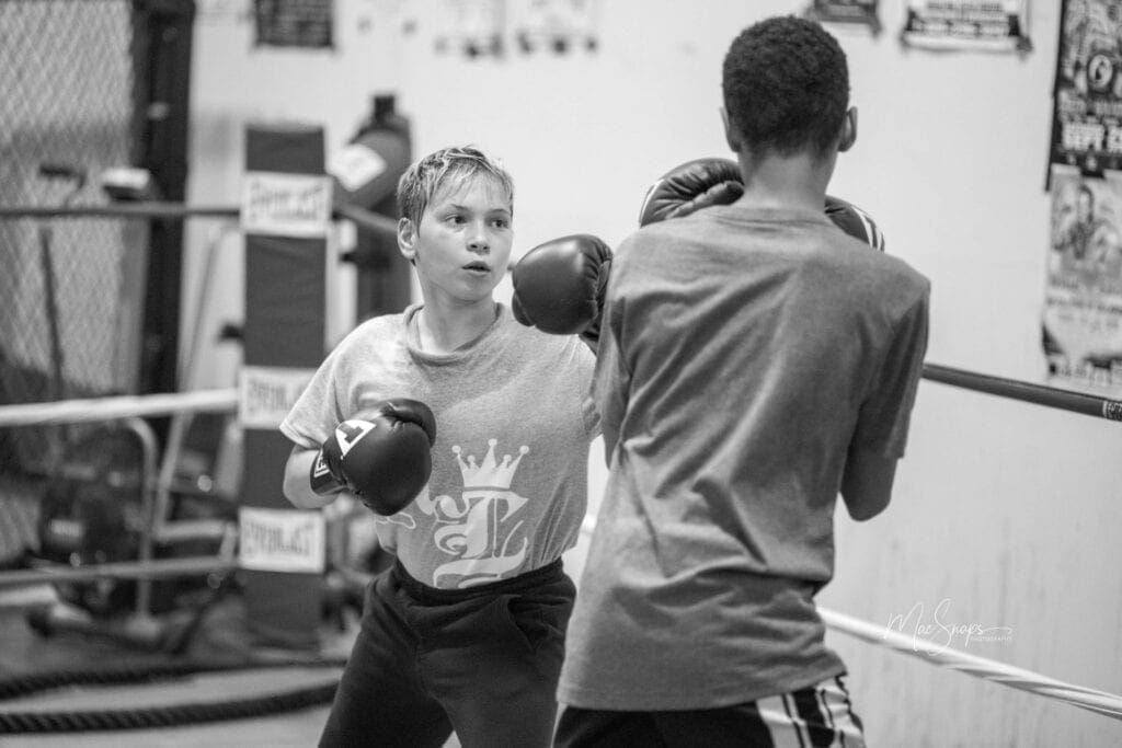 Two young males boxing. at R.L. Strength and Conditioning owned by Rick Leigh