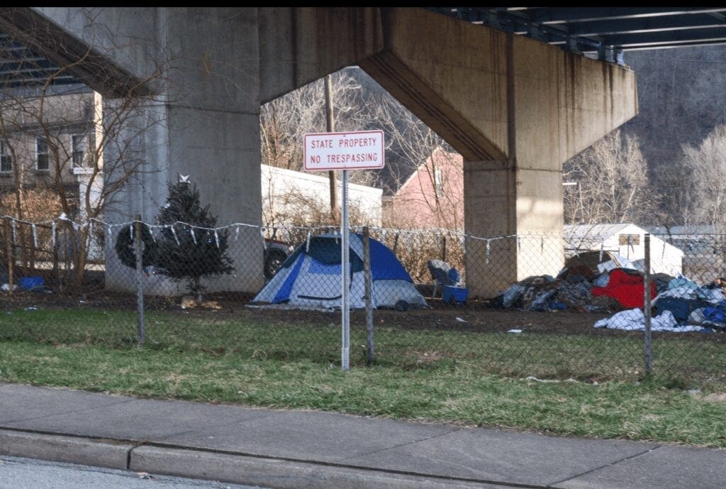 Tents under a bridge.