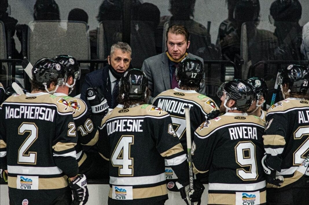 A man talking to a team.