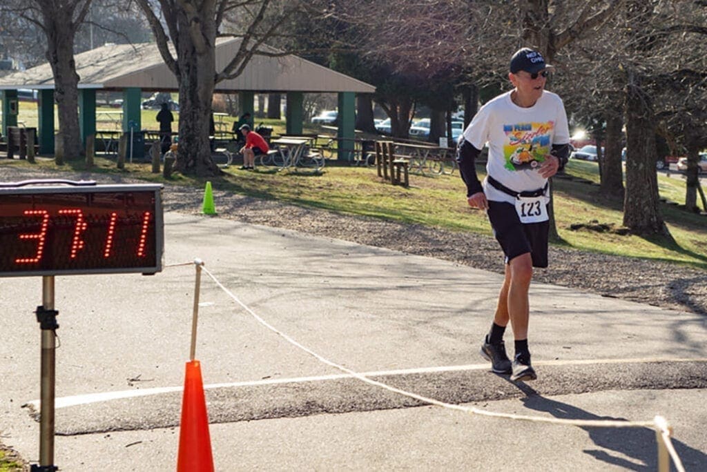 Allan Oleka crosses the finish line in Barnesville