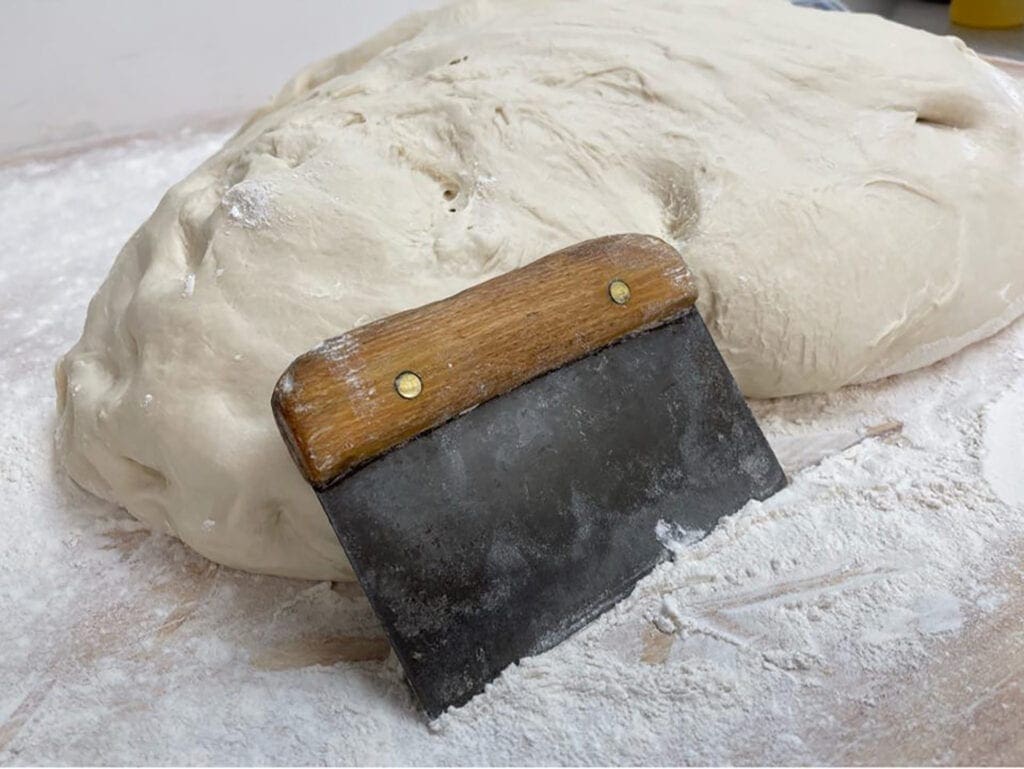 Wally's dough is pictured with a pastry knife