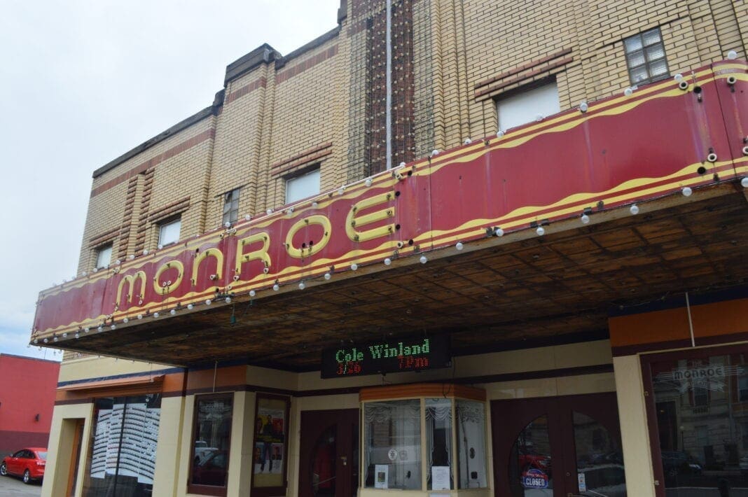 The front facade of an old theatre.