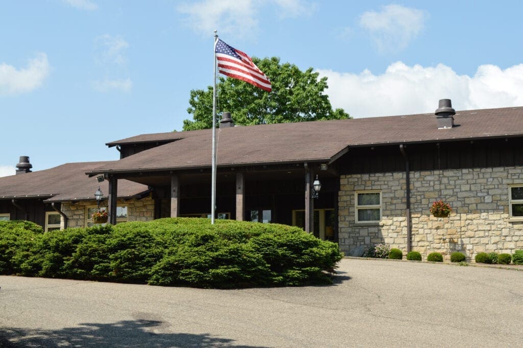 A building with a dark brown roof.