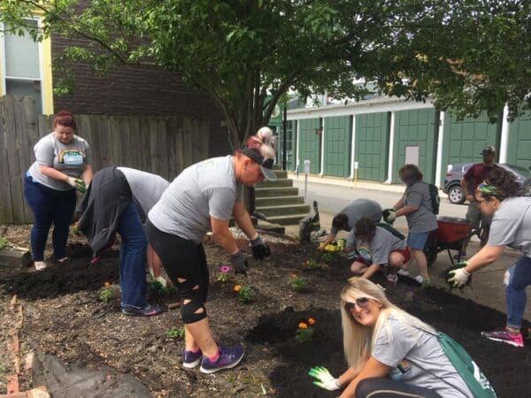 Orrick volunteers planting flowers and doing cleanup in Centre Market for Pride in Wheeling