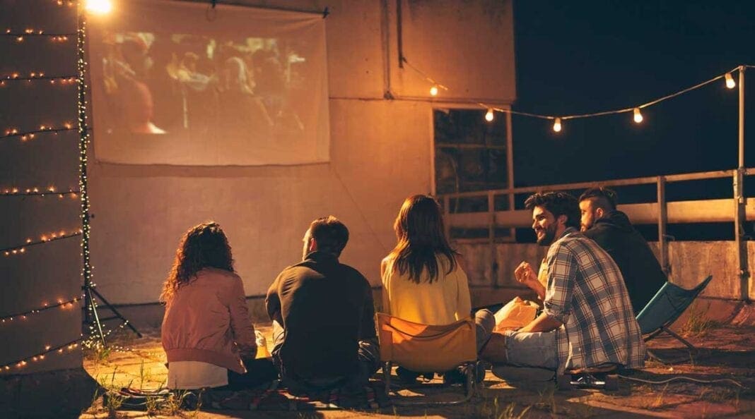 A group of people watching a movie.