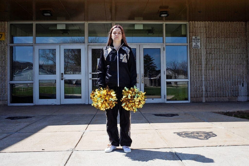 A girl with pom-poms.