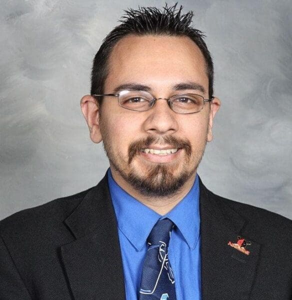 A man posing for a headshot.