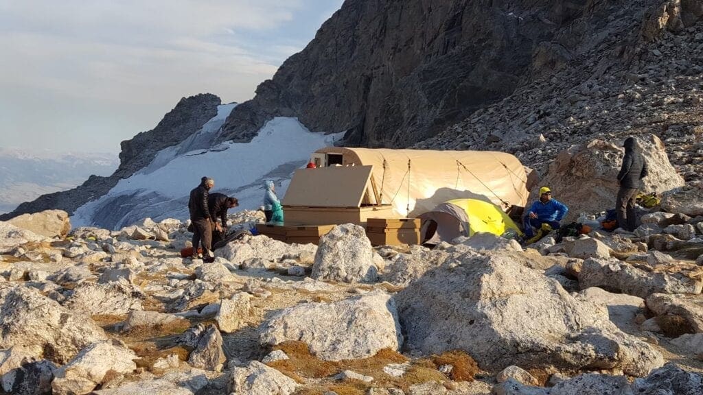 A small hut on a mountain.