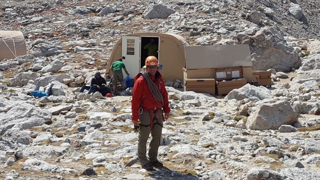A man at a mountain base camp.