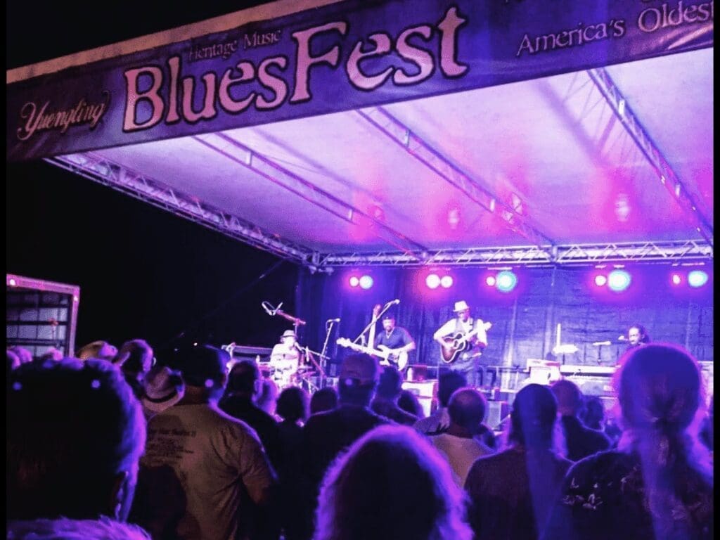 A band on a stage at night.