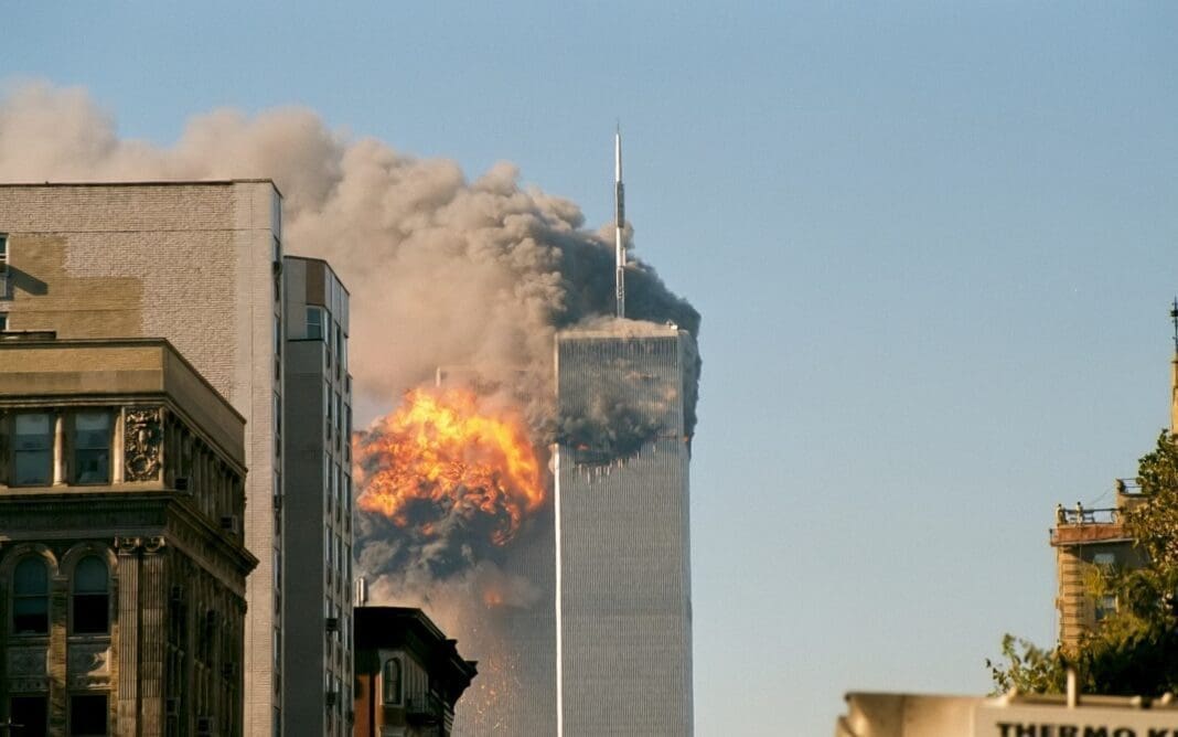 One of the towers in New York City being struck by a plane.