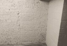 A bricked-in area in a basement of a historic building.