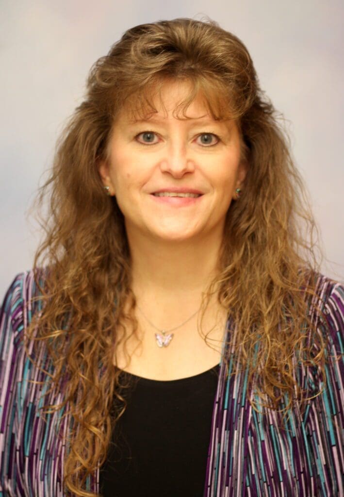 A woman posing for a photo.