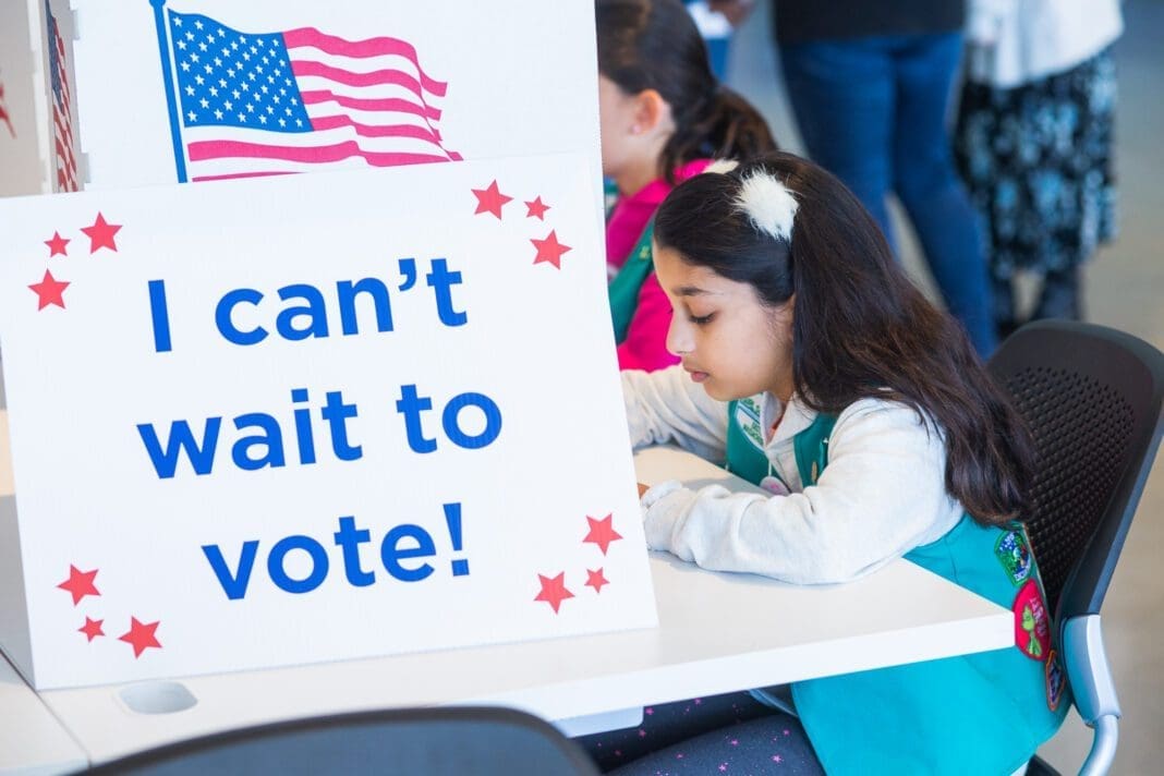 A young lady who can't wait to vote.