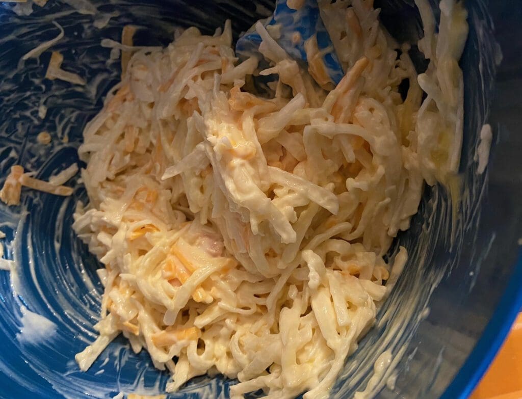 Cheesy potatoes being prepared.