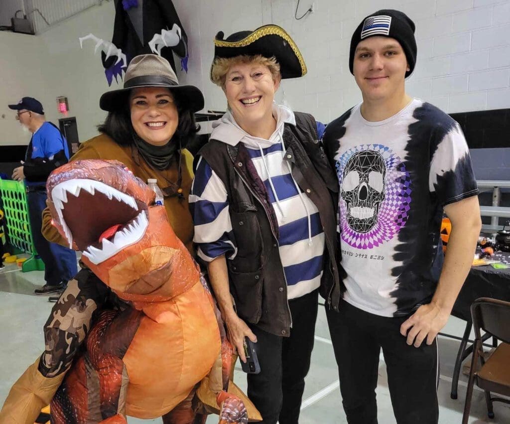 Three people at a Halloween party.