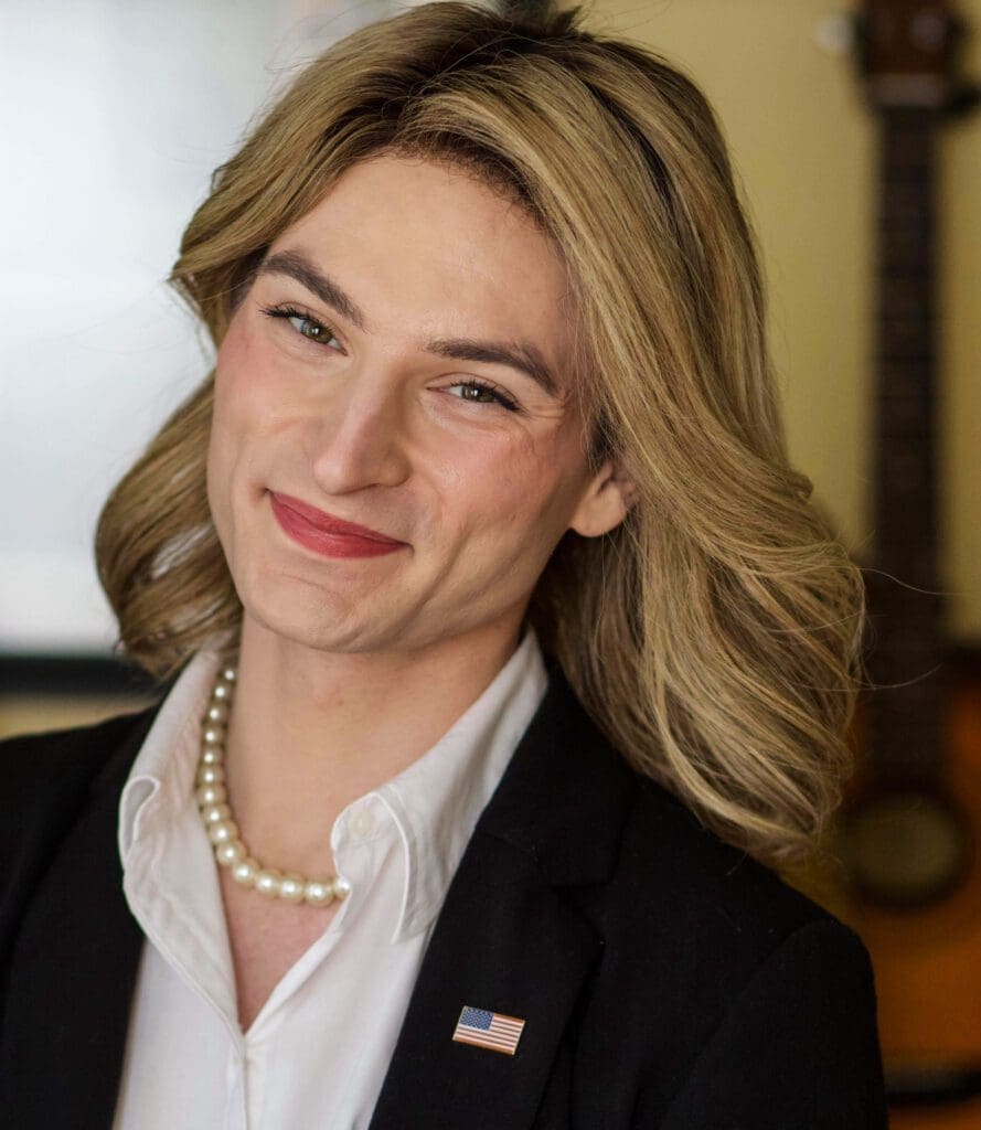 A photo of a smiling female.