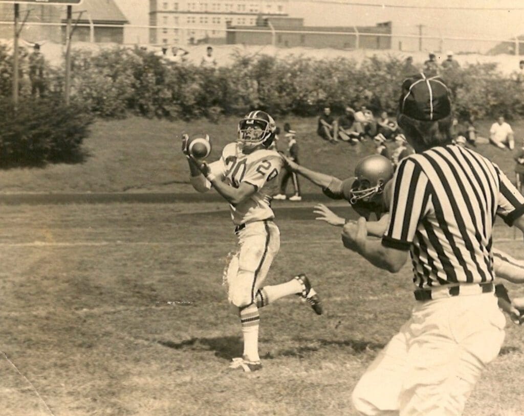 A football player catching a ball.