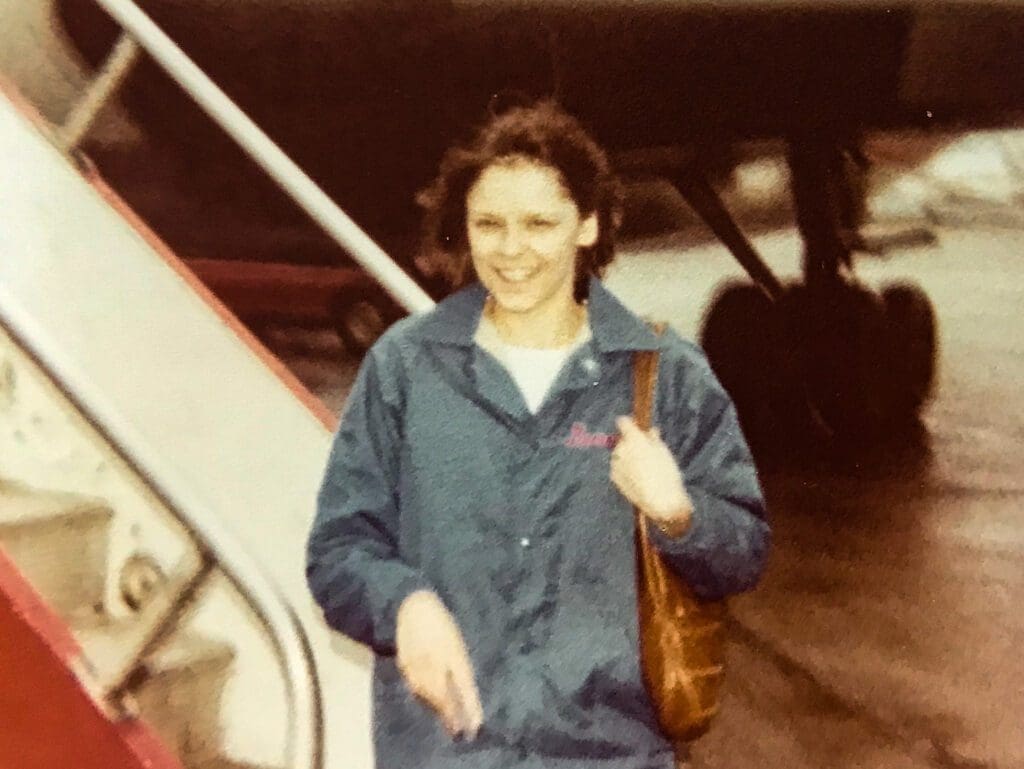 A woman near a plane.