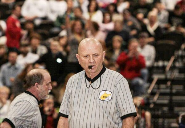 A man dressed like a referee.