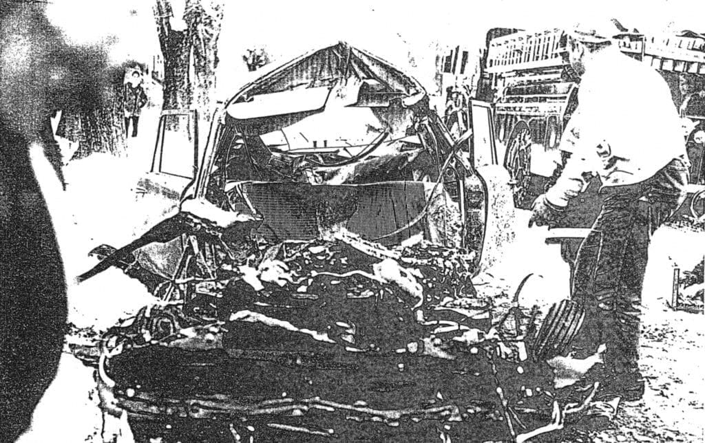 A sketch of a bombed car.