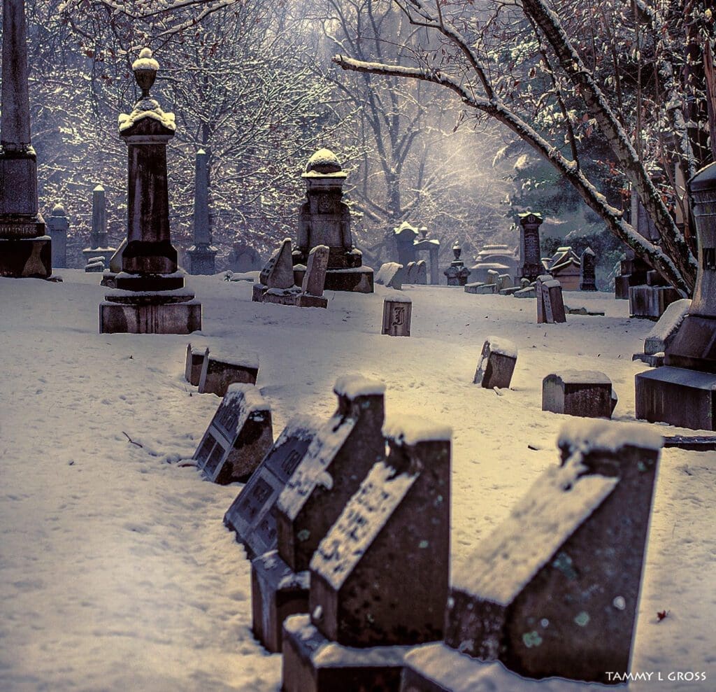 A cemetery that is snow covered.