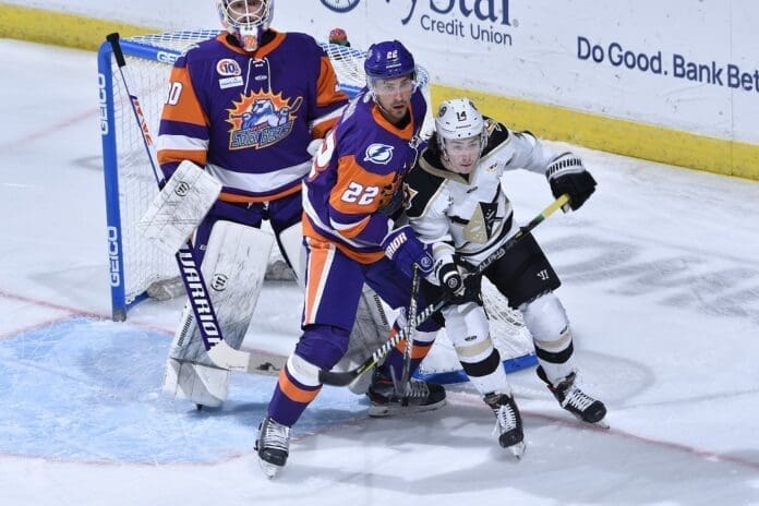 Hockey players on ice.