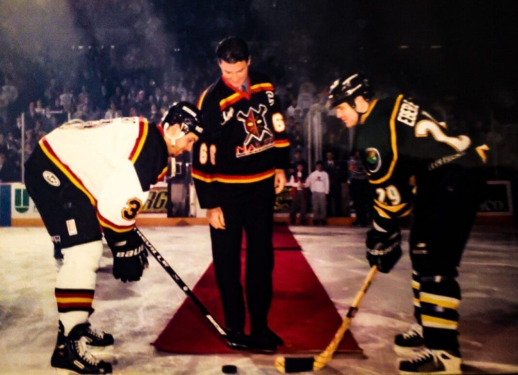 Two hockey players ready for a face-off.