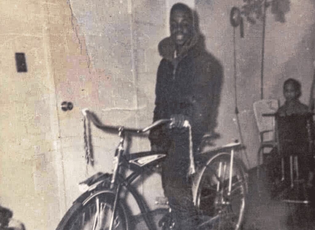 A young boy on a bike.