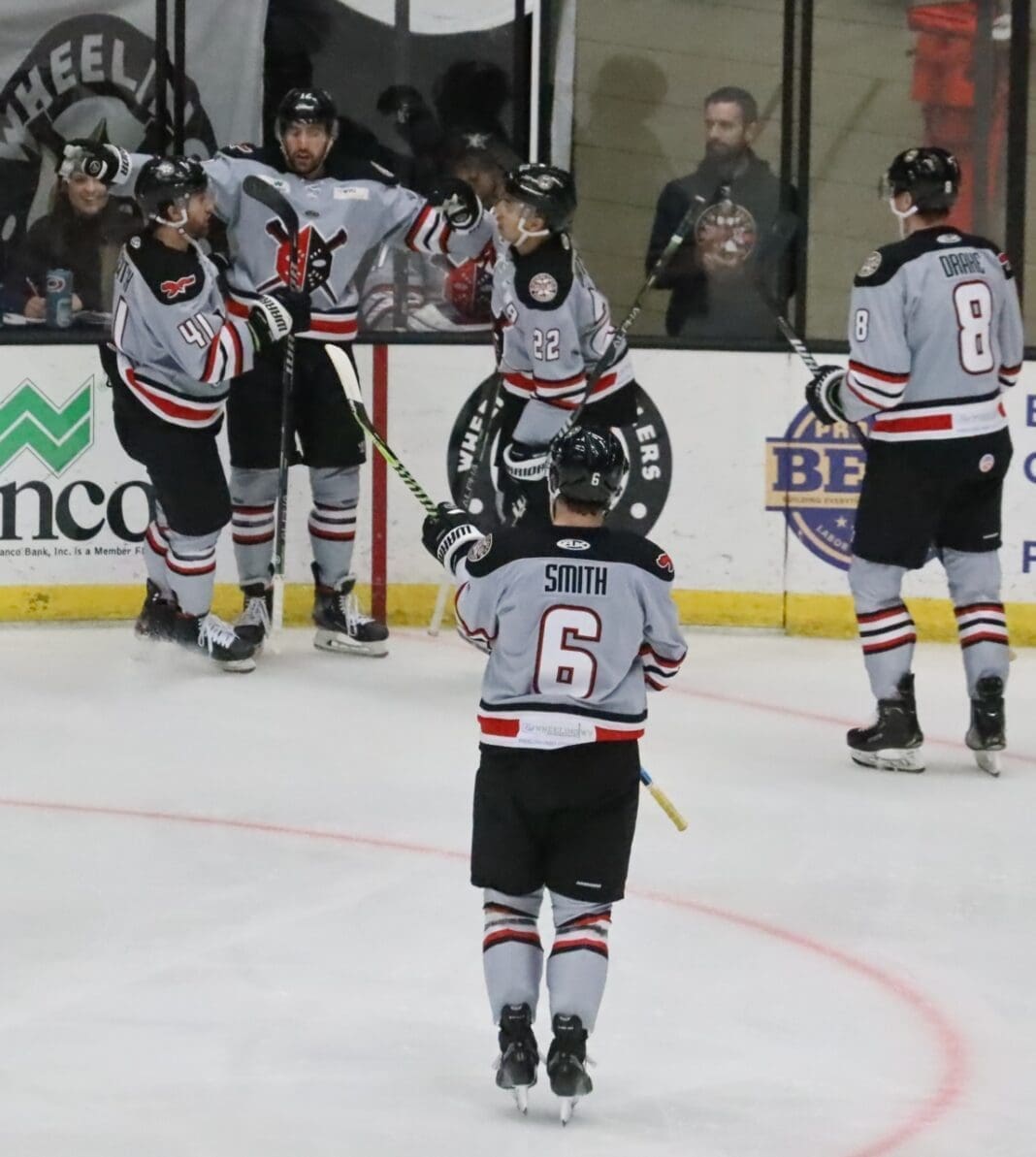 Hockey players on ice.