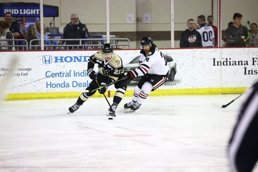 Hockey players on ice.