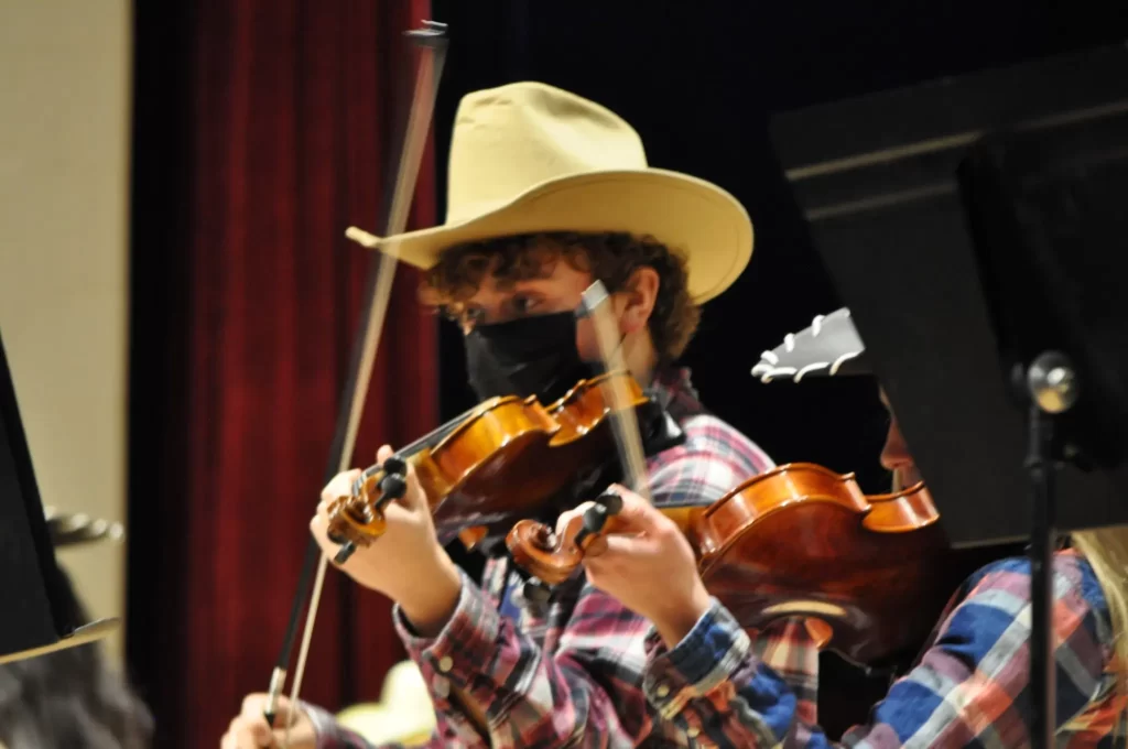 A person wearing a cowboy hat.