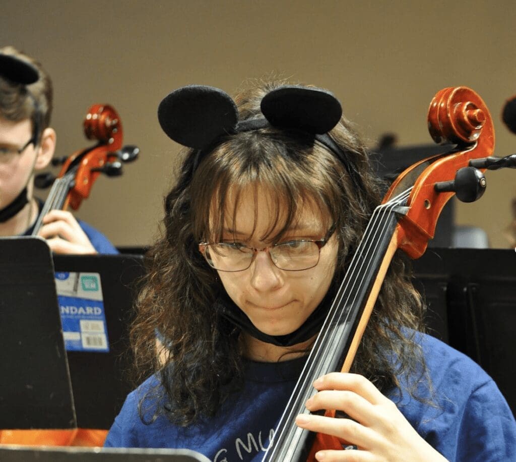 A female playing an instrument.