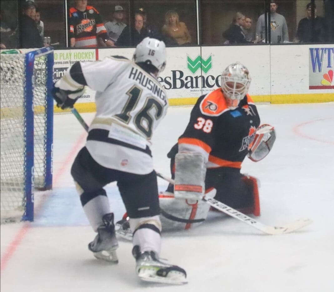 Two hockey players on the ice.