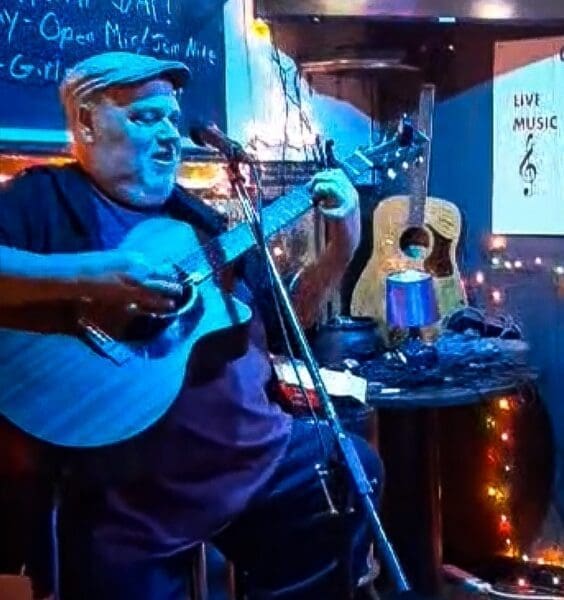 A man playing in a bar.