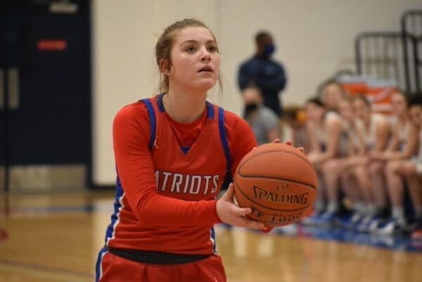 A female at the free throw line.