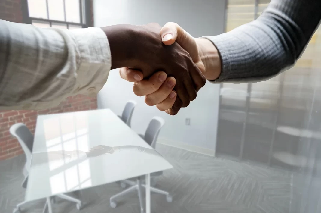 Two people shaking hands.