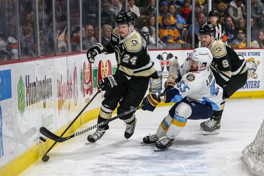 Hockey players on ice.