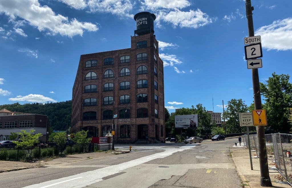 An intersection near a large building.