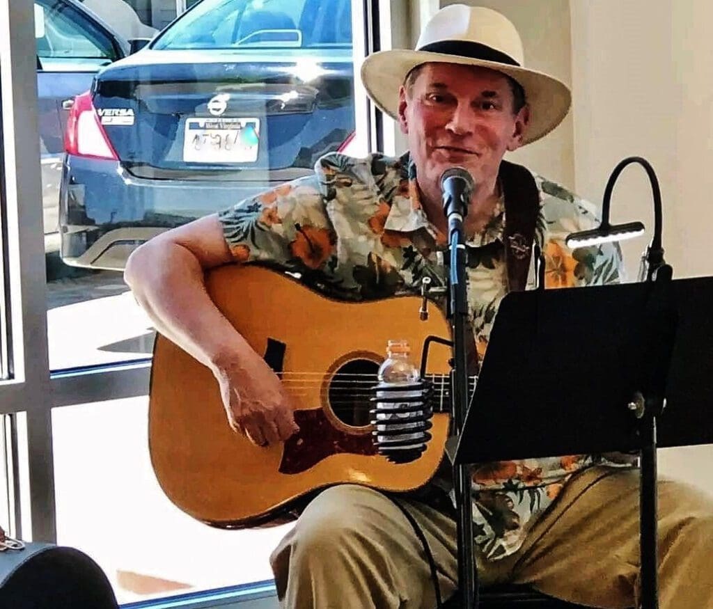 A man playing the guitar.