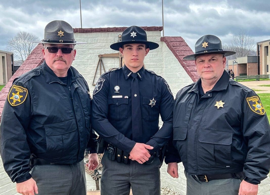 Three men standing for a photo.