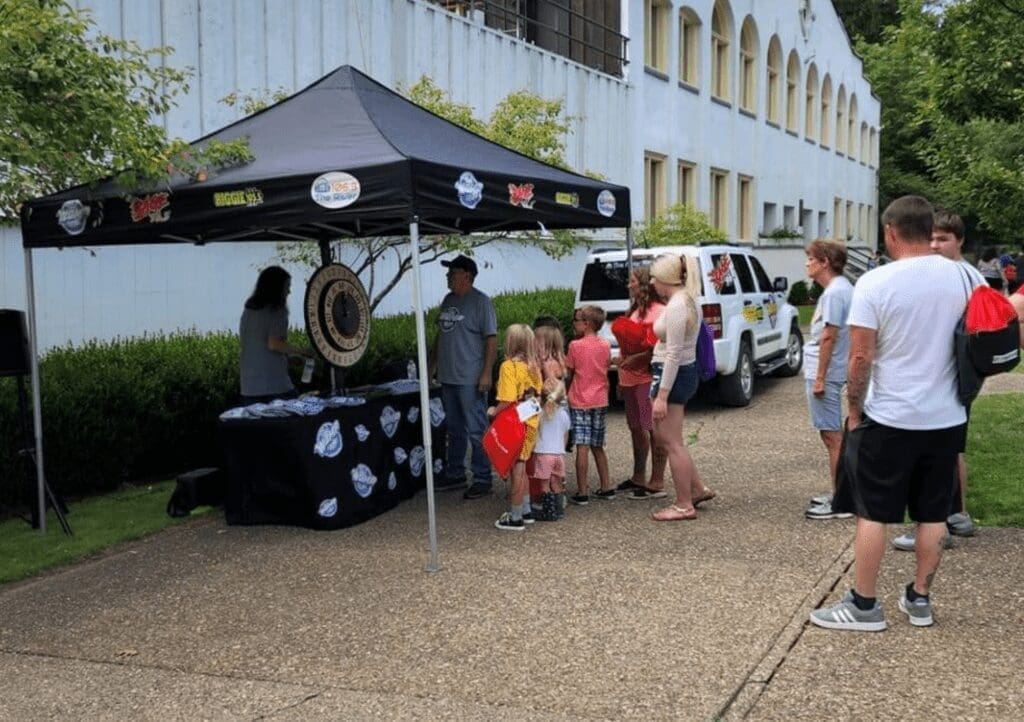 A tent on a sidewalk.