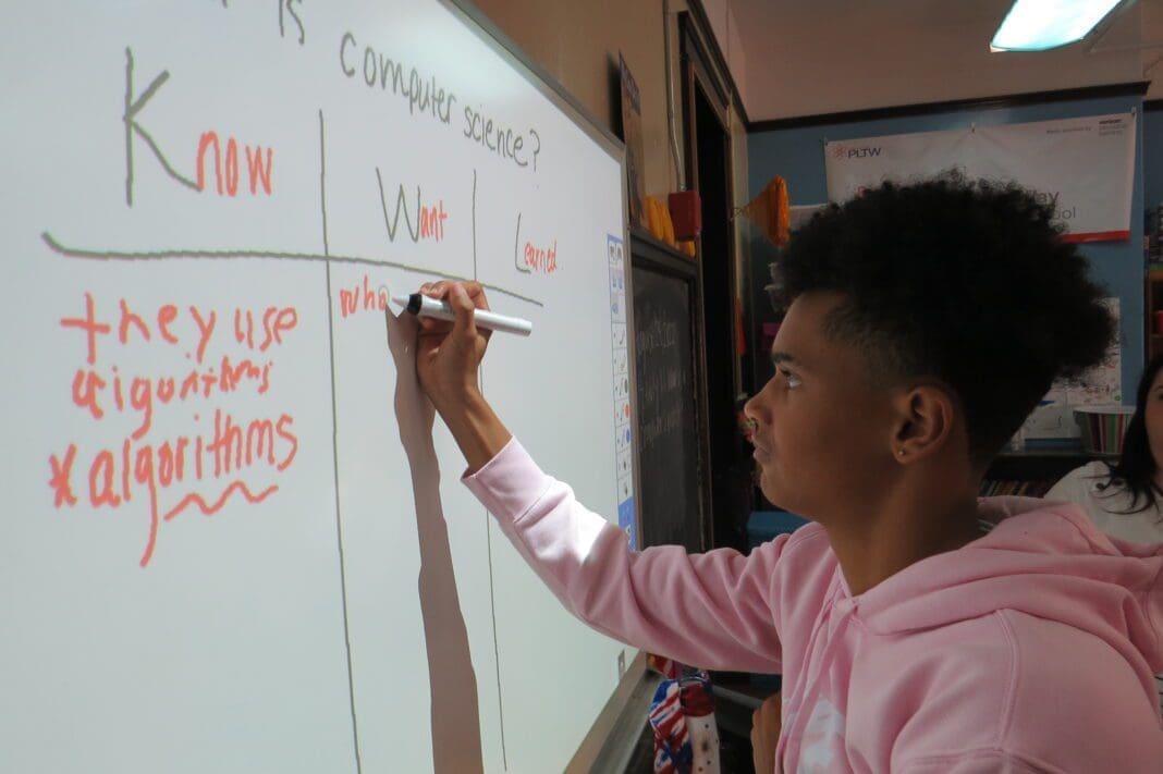 A child at a smartboard.