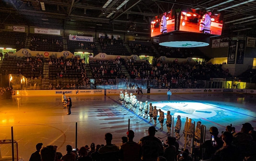 The inside of an arena before a hockey game.