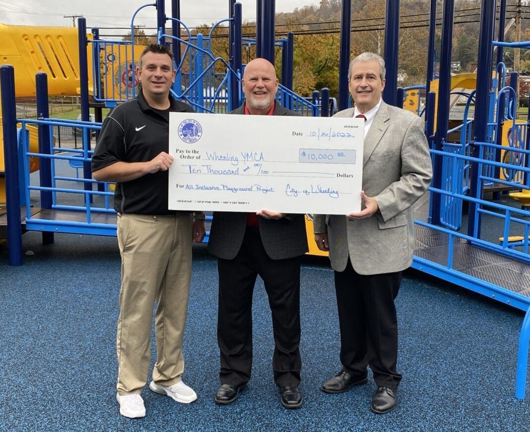 Three men holding a giant check.