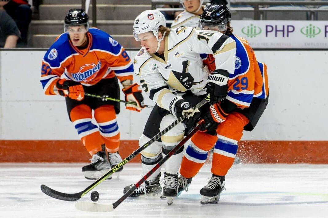 Men playing hockey.