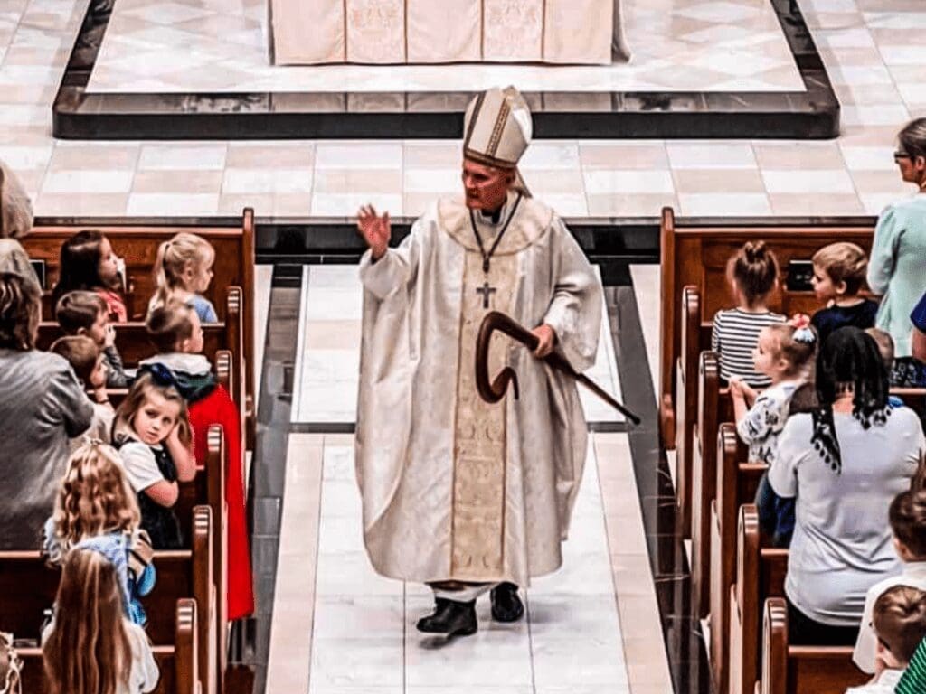 A bishop in an aisle.