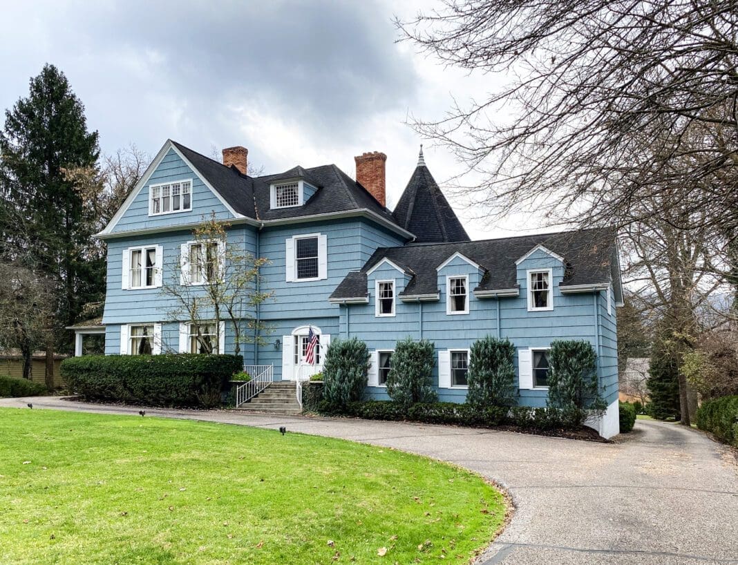 A large house with a yard.