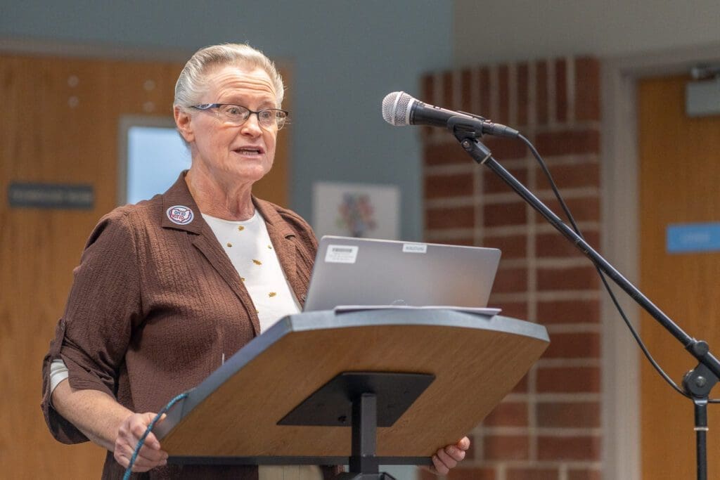 A lady at a podium.